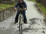 SX17151 Jenni cycling through flooded road.jpg